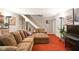 Cozy living room with plush seating and a staircase leading upstairs at 4505 Stratford Dr, Anderson, IN 46013
