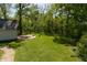 Expansive backyard features a well-maintained lawn and a charming fire pit area, ideal for outdoor entertaining and relaxation at 455 E Main St, Danville, IN 46122