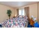 Comfortable bedroom featuring a queen-sized bed and a decorative floral comforter at 455 E Main St, Danville, IN 46122