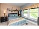 Inviting bedroom with a comfortable bed, ambient lighting, and neutral decor at 455 E Main St, Danville, IN 46122