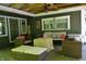 Cozy covered outdoor living area with comfortable seating and stylish decor for relaxing and entertaining at 455 E Main St, Danville, IN 46122