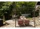 Inviting outdoor deck area, perfect for relaxing and entertaining, with overhead pergola and a dining set for enjoying outdoor meals at 455 E Main St, Danville, IN 46122