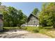 Charming home with a spacious driveway and a lush, wooded backdrop at 455 E Main St, Danville, IN 46122