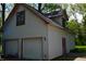 Spacious two-car garage featuring red trim, offering ample parking and storage solutions at 455 E Main St, Danville, IN 46122