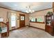 Cozy living room with vintage details, natural light, and hardwood trim at 455 E Main St, Danville, IN 46122