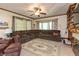 Spacious living room features a sectional sofa, ceiling fan, and a large window for natural light at 455 E Main St, Danville, IN 46122