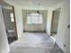 Renovated bedroom features gray floors, fresh paint, and ample natural light at 4986 Adkins St, Columbus, IN 47201