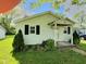 Charming single-story home with a cozy front porch, black shutters, and a well-manicured lawn at 4986 Adkins St, Columbus, IN 47201