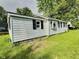 Exterior side view of a garage, highlighting its functional design and simple aesthetic at 4986 Adkins St, Columbus, IN 47201