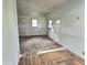 Living room showcasing hardwood floors, windows, and an entryway door, ready for personalization at 4986 Adkins St, Columbus, IN 47201