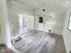 Large living room with new flooring, fresh paint, and space for custom upgrades at 4986 Adkins St, Columbus, IN 47201