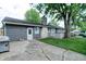 The backyard features a patio, grass, and an entrance door at 506 S Green St, Brownsburg, IN 46112