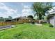 The backyard has a well-manicured lawn, seating area, playground and garden beds at 506 S Green St, Brownsburg, IN 46112