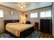 Comfortable bedroom with a ceiling fan, large bed, and traditional furnishings at 506 S Green St, Brownsburg, IN 46112