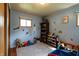 Bright, fun bedroom with toy storage and blue walls adorned with cartoon themed decor at 506 S Green St, Brownsburg, IN 46112