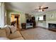 Cozy living room with hardwood floors, comfortable seating, and a fireplace at 506 S Green St, Brownsburg, IN 46112