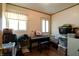 A spare room with wood floors, two windows, and filled with musical equipment and storage at 506 S Green St, Brownsburg, IN 46112