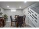 Finished basement features a bar area, a table with chairs, and access to the stairwell at 5119 Ralston Ave, Indianapolis, IN 46205