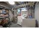 Utility basement with modern washer and dryer, storage shelves, and updated mechanical systems at 5119 Ralston Ave, Indianapolis, IN 46205