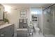 Elegant bathroom with a gray vanity, marble countertop, modern fixtures, and glass-enclosed shower at 5119 Ralston Ave, Indianapolis, IN 46205