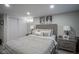 Comfortable bedroom featuring a rustic wood bed frame, soft lighting, and neutral decor at 5119 Ralston Ave, Indianapolis, IN 46205