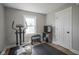 Workout area equipped with an elliptical machine, weights, and a TV at 5119 Ralston Ave, Indianapolis, IN 46205