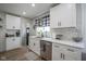 Bright kitchen featuring white cabinetry, modern stainless steel appliances, and a clean, stylish design at 5119 Ralston Ave, Indianapolis, IN 46205