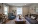 Bright and airy living room featuring hardwood floors, a plush sofa, and stylish decor with ample natural light at 5119 Ralston Ave, Indianapolis, IN 46205