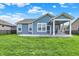 Beautiful backyard with a screened-in porch, patio, and lush green lawn, perfect for relaxation and outdoor activities at 5248 Holborn Ave, McCordsville, IN 46055