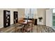 Dining area with a wooden table and chairs, plus shutters for an inviting atmosphere at 5248 Holborn Ave, McCordsville, IN 46055