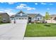 Charming home with a three-car garage, well-manicured lawn, and attractive curb appeal in a desirable neighborhood at 5248 Holborn Ave, McCordsville, IN 46055