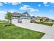 Attractive home showcasing a three-car garage and a well-manicured lawn, set in a neighborhood setting at 5248 Holborn Ave, McCordsville, IN 46055