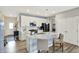 Well-lit kitchen with a center island, modern appliances, and stylish pendant lighting at 5248 Holborn Ave, McCordsville, IN 46055