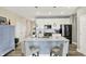 Modern kitchen with a large island, quartz countertops, and stainless steel appliances at 5248 Holborn Ave, McCordsville, IN 46055