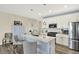 Kitchen with white cabinets, stainless steel appliances, and a center island with bar seating at 5248 Holborn Ave, McCordsville, IN 46055