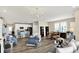 Open-concept living room and kitchen area with modern decor and plenty of natural light at 5248 Holborn Ave, McCordsville, IN 46055