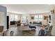 Spacious living room features hardwood floors, plantation shutters, and comfortable seating arrangements at 5248 Holborn Ave, McCordsville, IN 46055