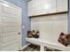 Mudroom with built-in bench, storage, and hooks, perfect for organization at 5248 Holborn Ave, McCordsville, IN 46055