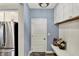 Mudroom with blue walls and white wainscoting, bench seating and upper storage space at 5248 Holborn Ave, McCordsville, IN 46055