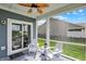 Cozy screened porch furnished with comfortable seating, offering a relaxing outdoor living space with a ceiling fan at 5248 Holborn Ave, McCordsville, IN 46055