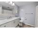 Bathroom featuring a white vanity, large mirror, gray walls, and tile floors at 5312 Larita Ln, Anderson, IN 46017
