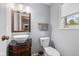 Half bathroom with a vessel sink on a vanity and an oval-framed mirror at 5312 Larita Ln, Anderson, IN 46017
