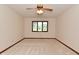 Bright bedroom with large window and ceiling fan, offering ample natural light and comfort at 5361 Carnoustie Cir, Avon, IN 46123
