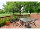 Outdoor deck with furniture, offering views of the lush yard and mature trees at 5361 Carnoustie Cir, Avon, IN 46123