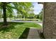 A view of a well-maintained home near a tranquil pond with a fountain at 5361 Carnoustie Cir, Avon, IN 46123
