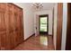 Welcoming foyer with hardwood floors, closet, and elegant chandelier lighting at 5361 Carnoustie Cir, Avon, IN 46123