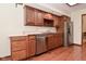 Well-appointed kitchen features stainless steel appliances and classic oak cabinetry at 5361 Carnoustie Cir, Avon, IN 46123