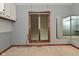 A room with a window, wood trim, and a mirror reflects additional space at 5361 Carnoustie Cir, Avon, IN 46123