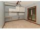 Versatile room with built-in cabinets, workbench, and a window at 5361 Carnoustie Cir, Avon, IN 46123