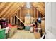 Unfinished attic space filled with boxes and belongings, providing ample storage possibilities for various needs at 5377 Crooked Stick Ct, Greenwood, IN 46142